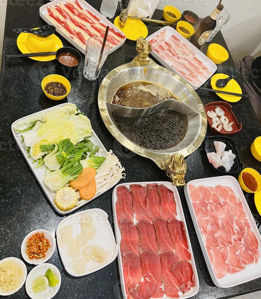 Set foods of meat and vegetables with Chinese soup photo