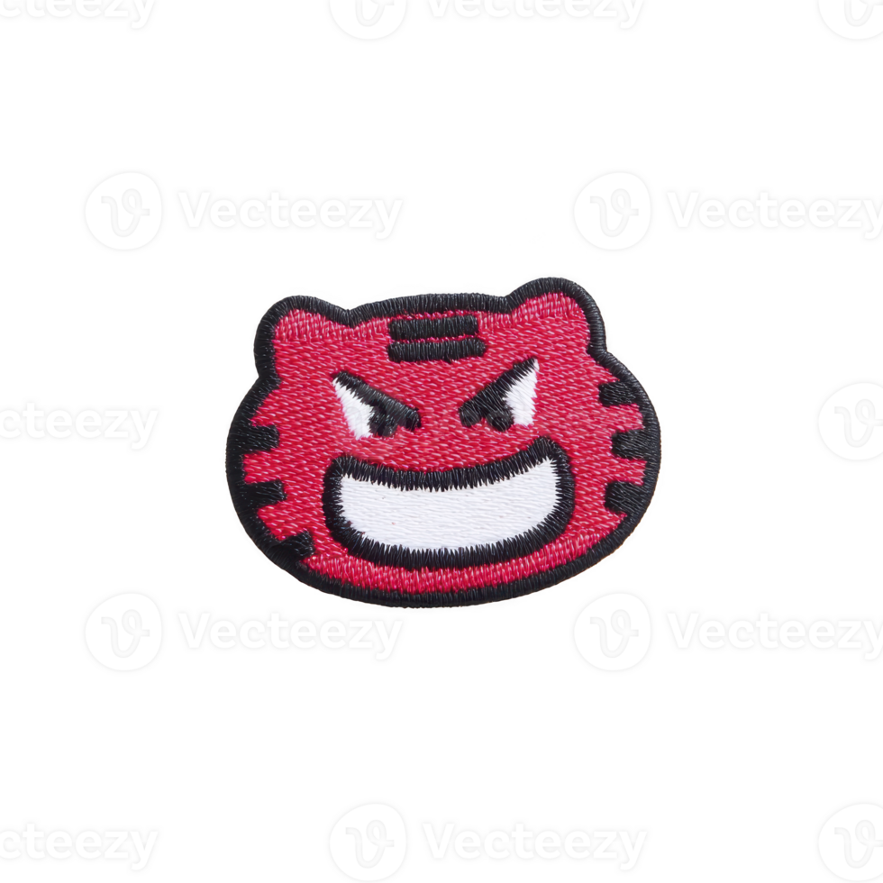 Red embroidered patch features cartoonish, angry face with wide grin and bold black outlines, conveying playful yet fierce expression png