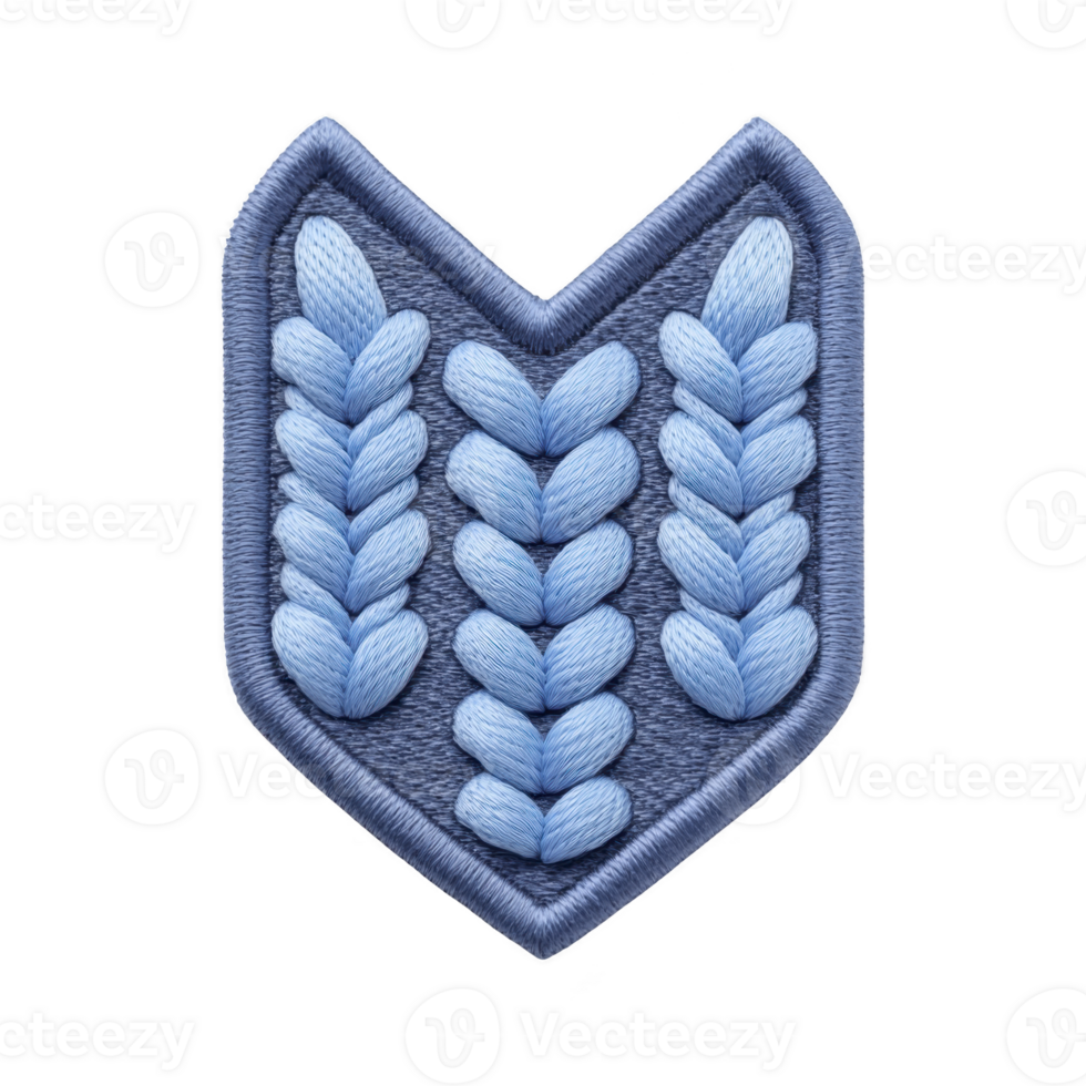 Blue embroidered patch with chevron shape features intricate braided patterns, creating textured and decorative design. patch is set against transparency background, highlighting its details png