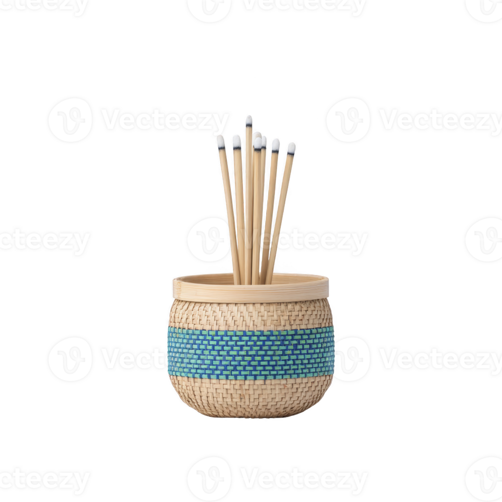 Decorative woven basket with blue accent holds several bamboo sticks with white tips, creating natural and artistic display png