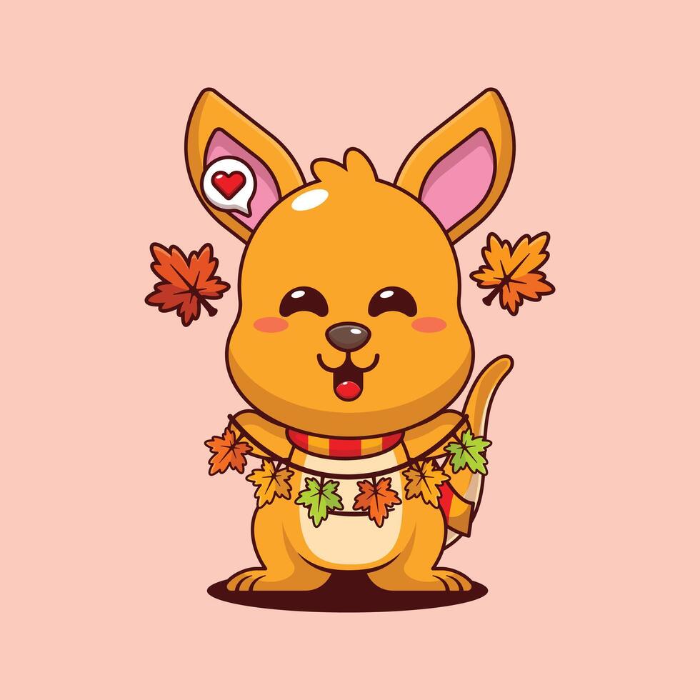 Cute kangaroo holding autumn leaf decoration in autumn day cartoon illustration vector