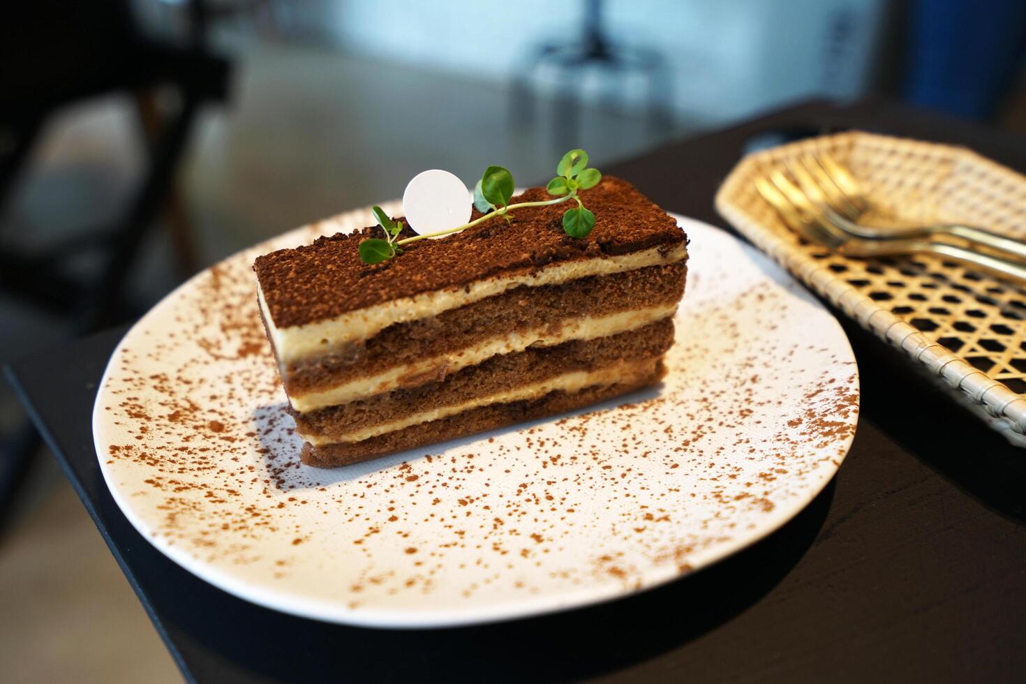 Tiramisu- Italian dessert made of Mascarpone custard layered with whipped cream, rum and coffee soaked ladyfingers photo