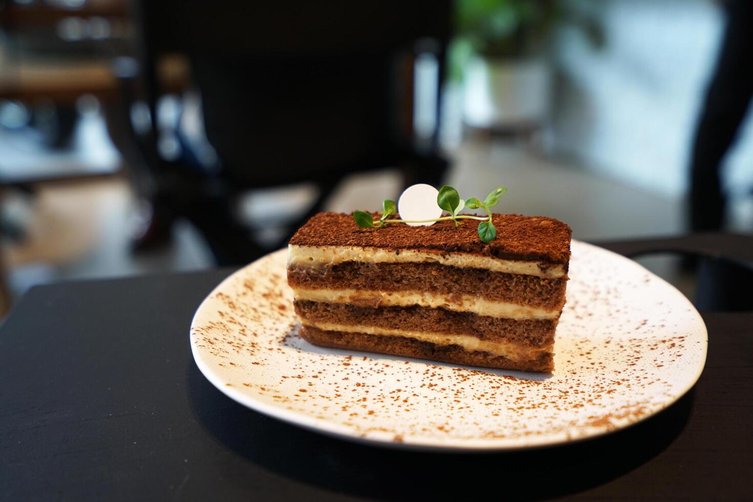 Close up Tiramisu- Italian dessert made of Mascarpone custard layered with whipped cream, rum and coffee soaked ladyfingers photo