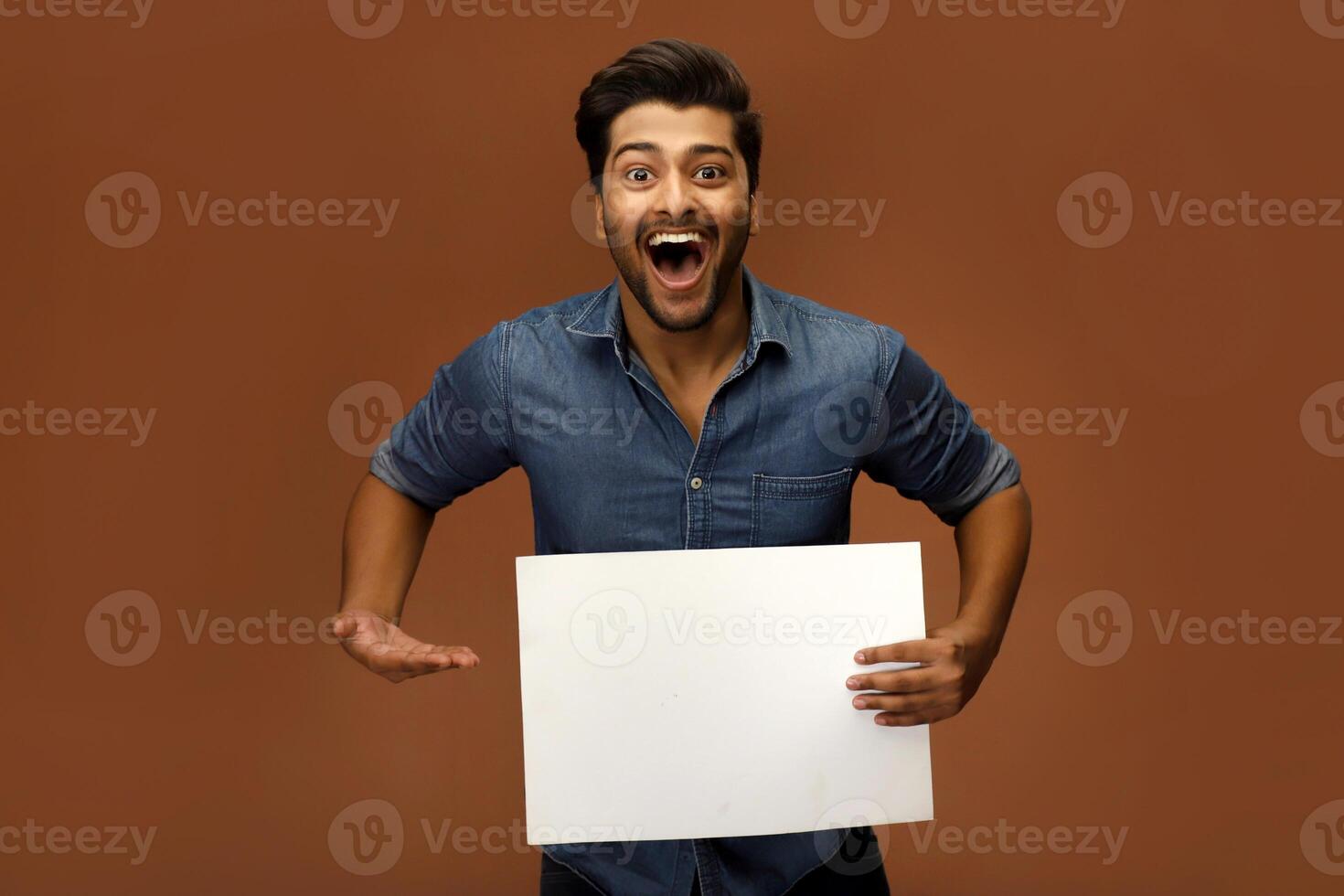 Indian model is holding an advertisement banner. photo