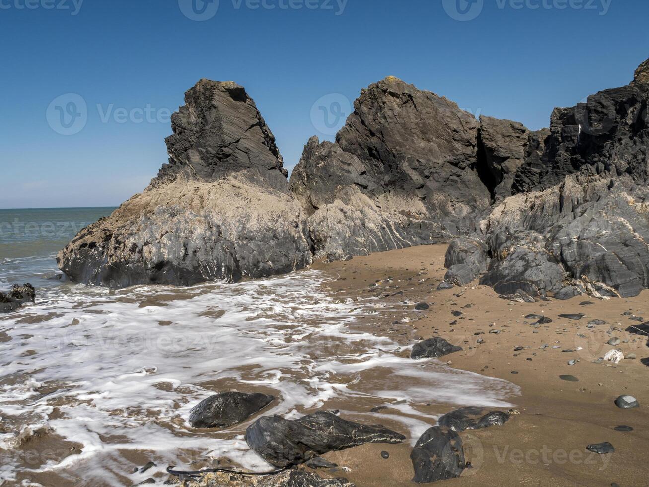 Rocks on the shore at Tresaith in Ceredigion, Wales photo