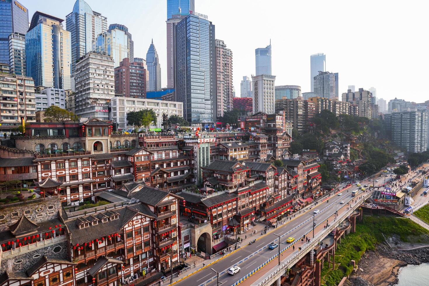 Chongqing, China-APR 02, 2025-Cityscape of the famous downtown shopping complex Hongyadong with illuminated bridge and highrise building in Chongqing photo