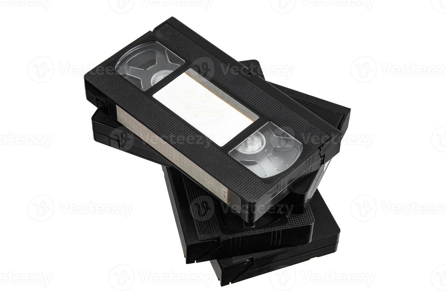 A collection of black VHS cassettes organized into a stack, highlighting their iconic retro design. photo