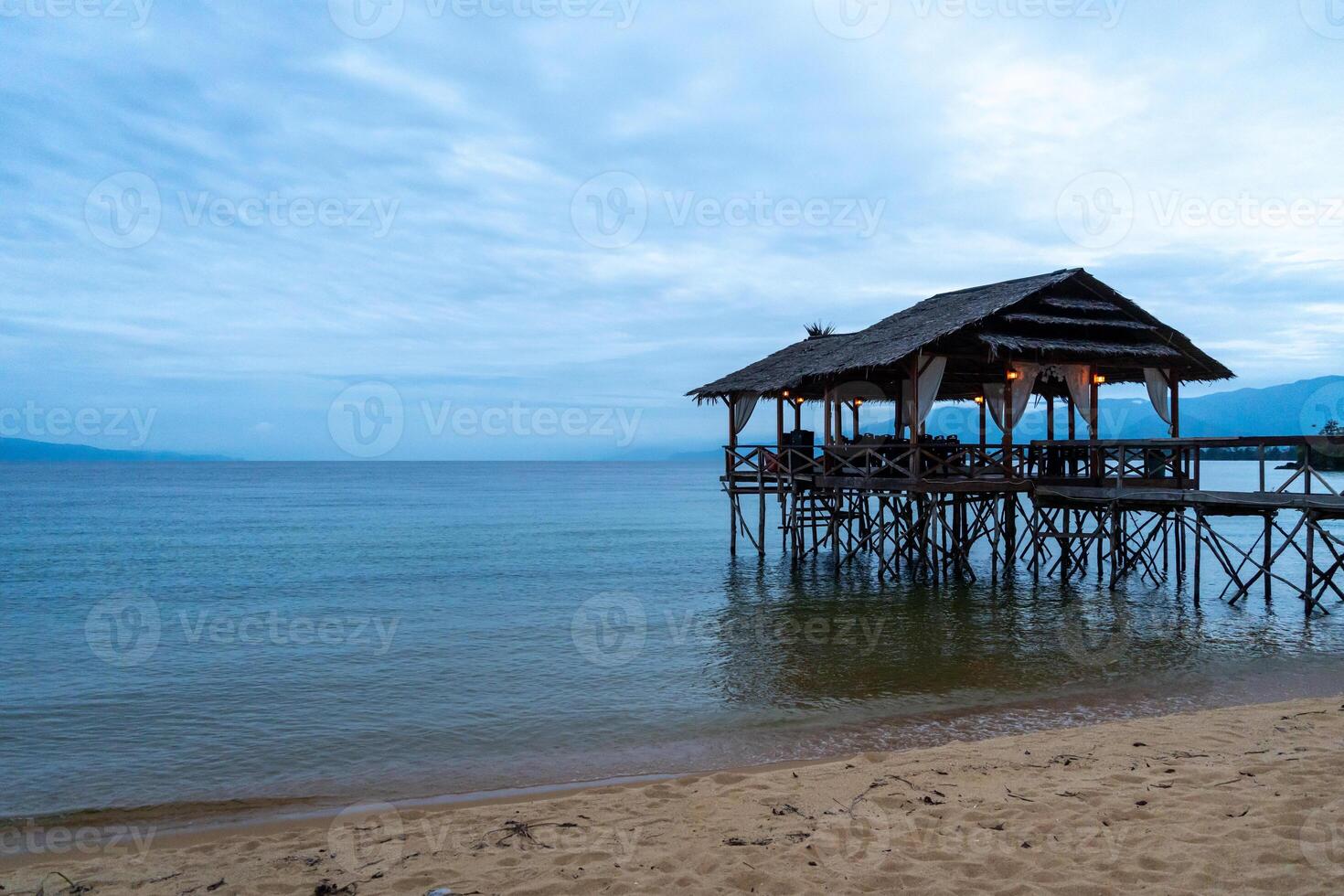 Wooden pier on the beach of Lake Poso, Tentena, Sulawesi photo