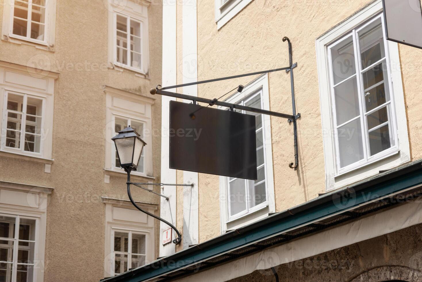 Modern blank rectangular signage mounted on rods, ideal for contemporary store branding, urban business identity or advertising design mockups photo