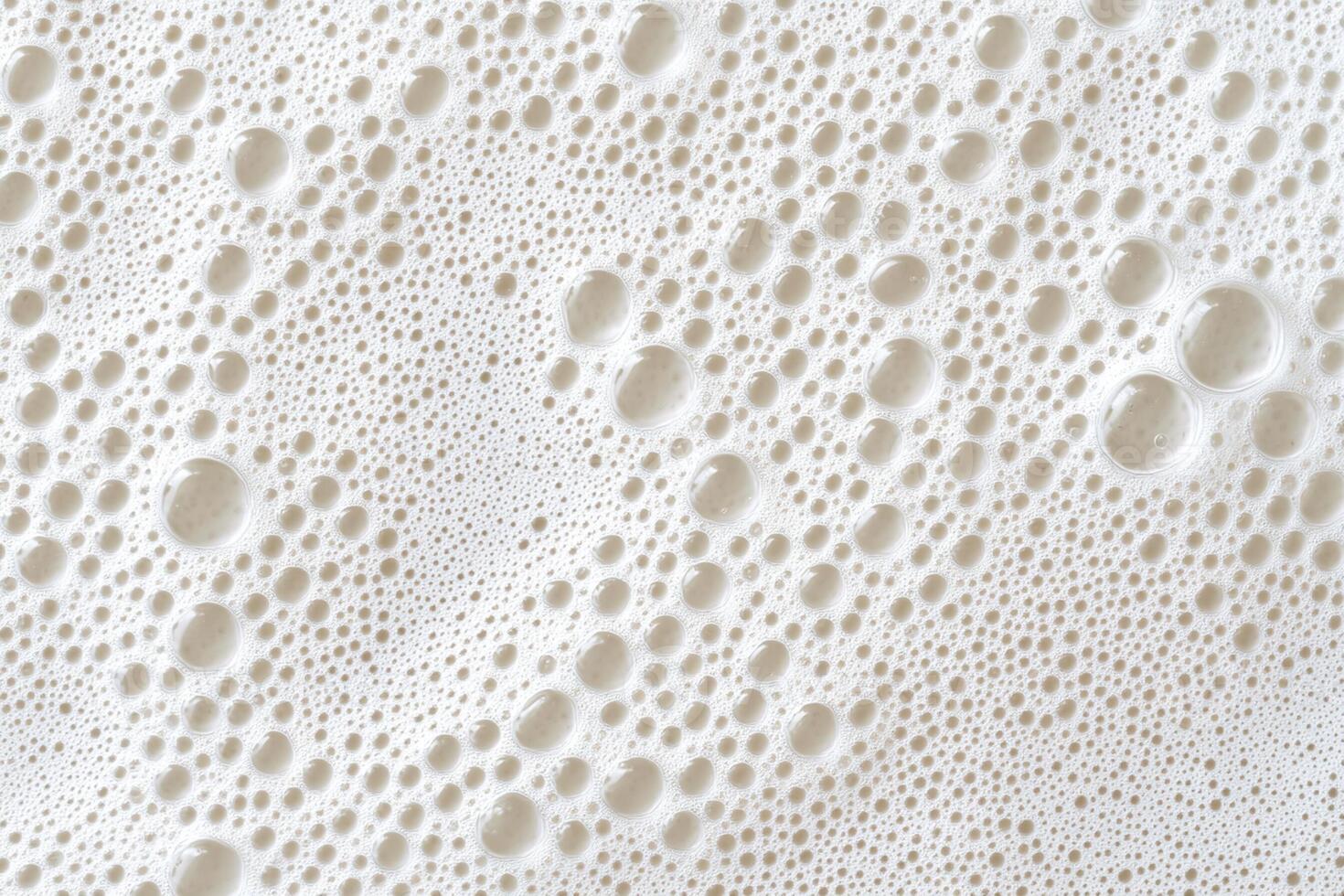 A close up of bubbles in a white substance photo