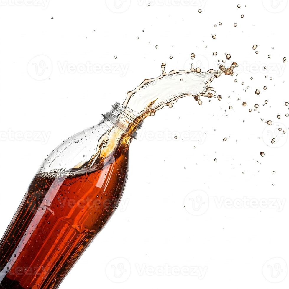 Cola spiling out of a bottle isolated on white photo