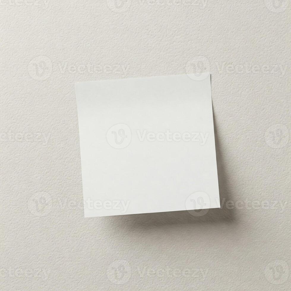 A mock white sticky note on a white wall photo
