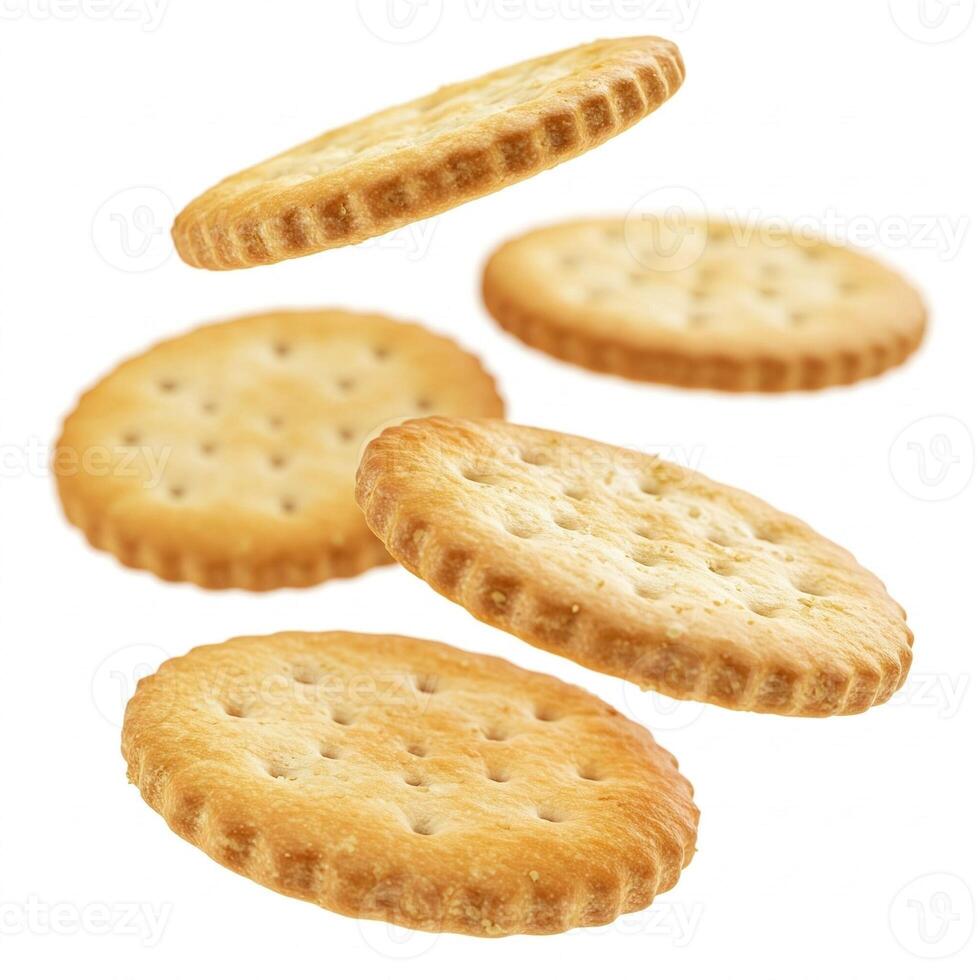 Floating salted crackers isolated on white photo
