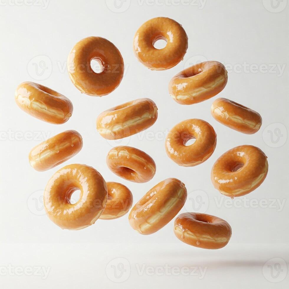 Many floating glazed donuts isolated on white photo