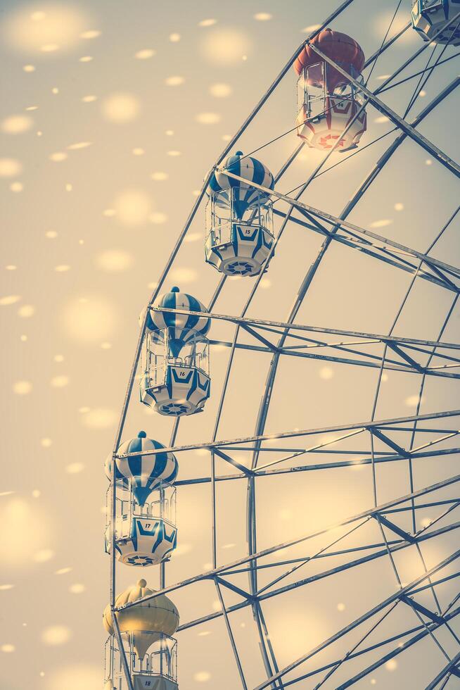 A ferris wheel is shown in the background photo