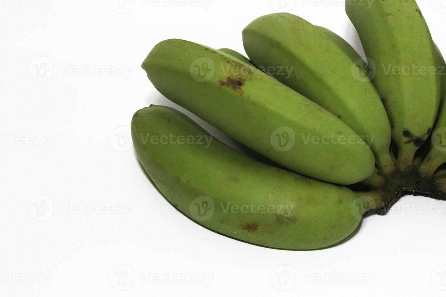 A green banana, after harvest, in a woven bamboo container, panen pisang cavendish, pisang ambon hijau, dari kebun, Ambon bananas, sweet, savory and a little sour, after harvest, rasanya manis gurih photo