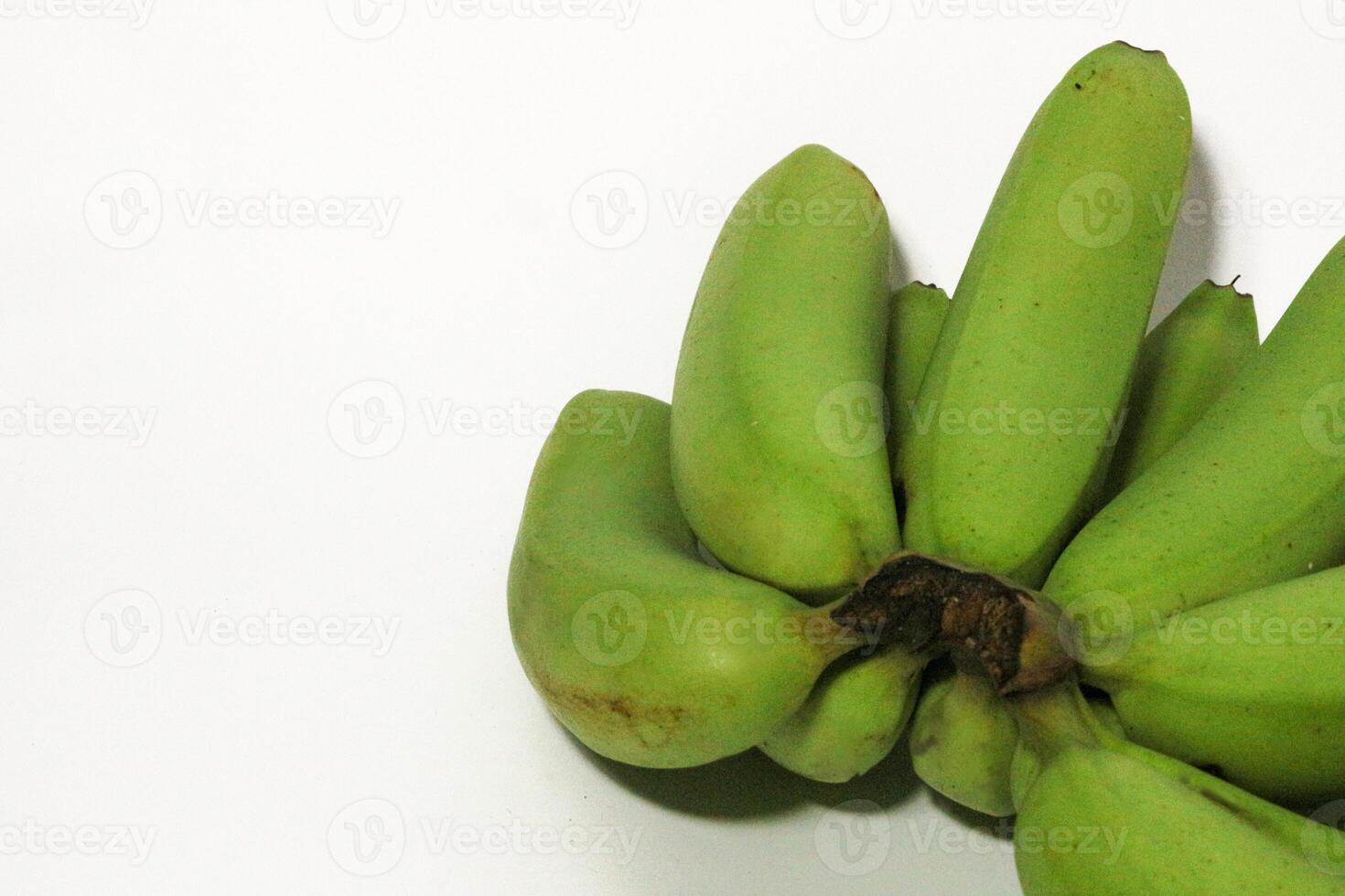 A green banana, after harvest, in a woven bamboo container, panen pisang cavendish, pisang ambon hijau, dari kebun, Ambon bananas, sweet, savory and a little sour, after harvest, rasanya manis gurih photo