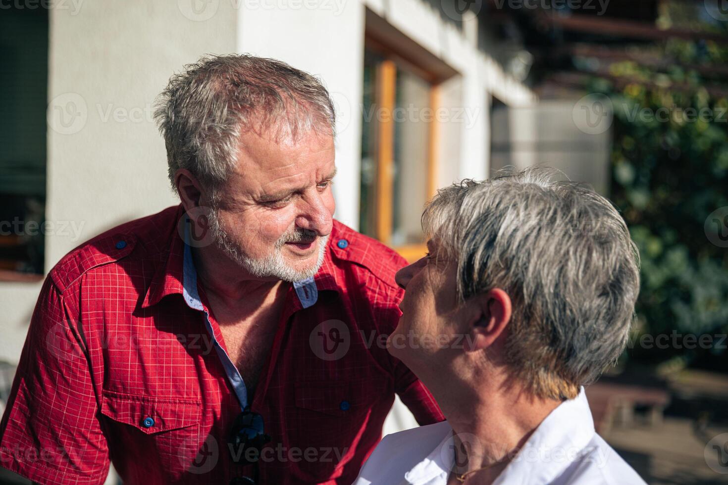 Affectionate Senior Couple Sharing a Moment of Intimate Conversation photo