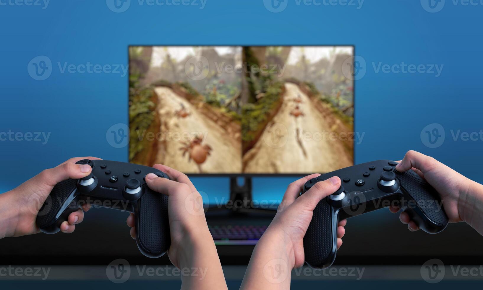 Two players using gamepads, playing a game on a computer with a split-screen display. Great for showcasing multiplayer gaming experiences photo