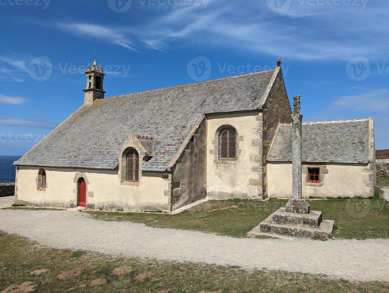 Coastal Brittany Historic Chapel on Pointe Du Van with Stunning Sky and Summer Sun photo