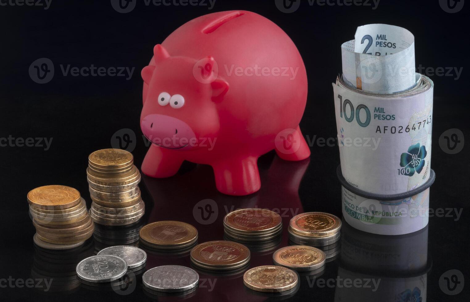 Red piggy bank Colombian coin photo