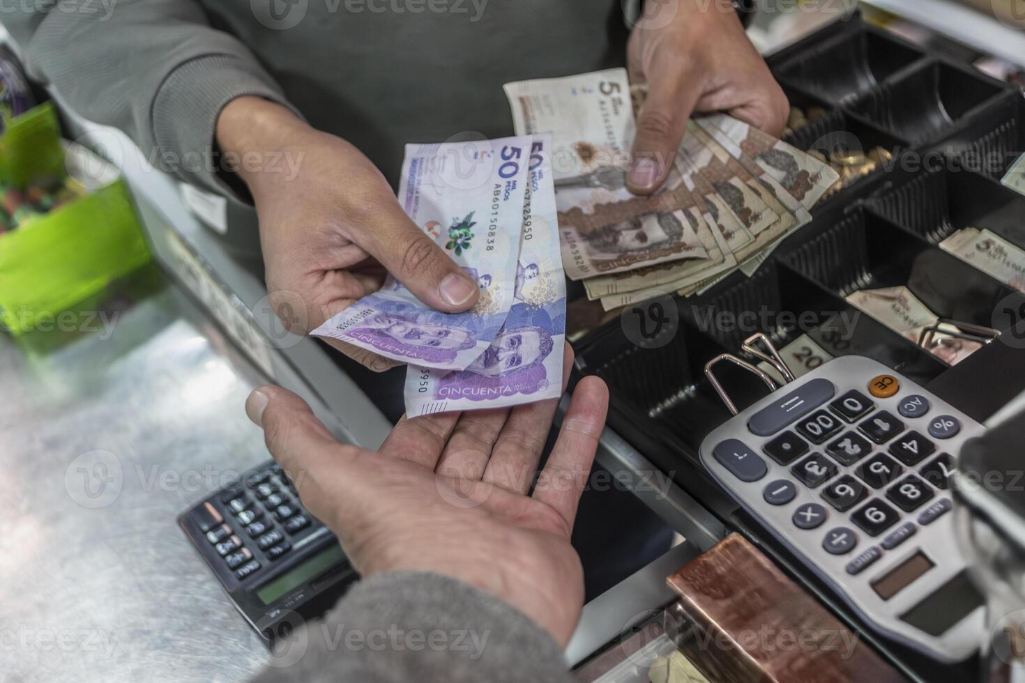 Colombian money, pesos, in the cash register. Concept of economy and inflation, Colombian pesos, banknotes, coins, economy, finance,Colombia photo