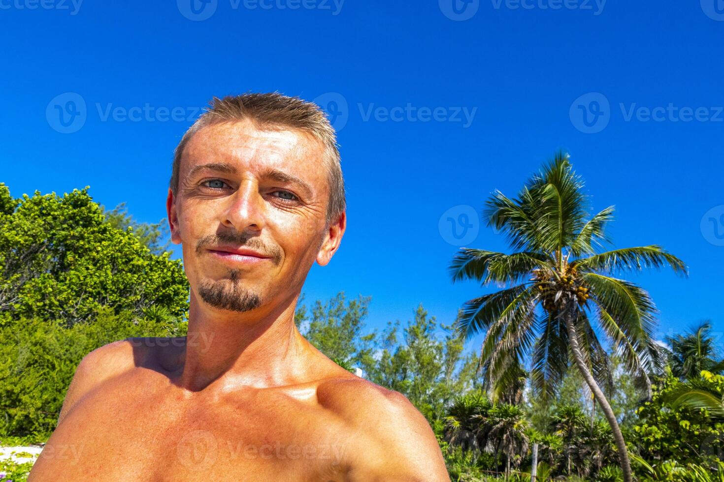 Male tourist Travelling man on Caribbean beach Playa del Carmen. photo