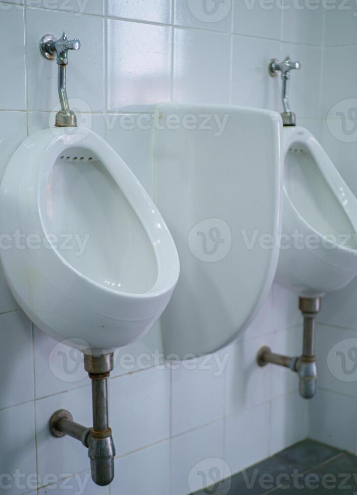 Toilet in the men's bathroom photo