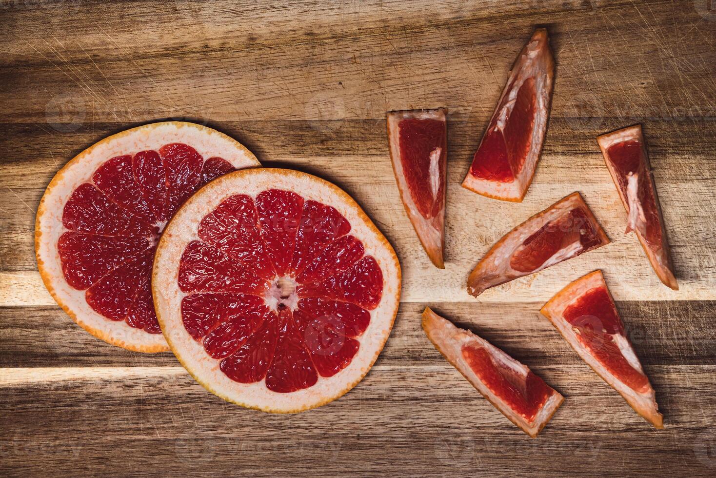 Vibrant Grapefruit Medley on Rustic Wood photo