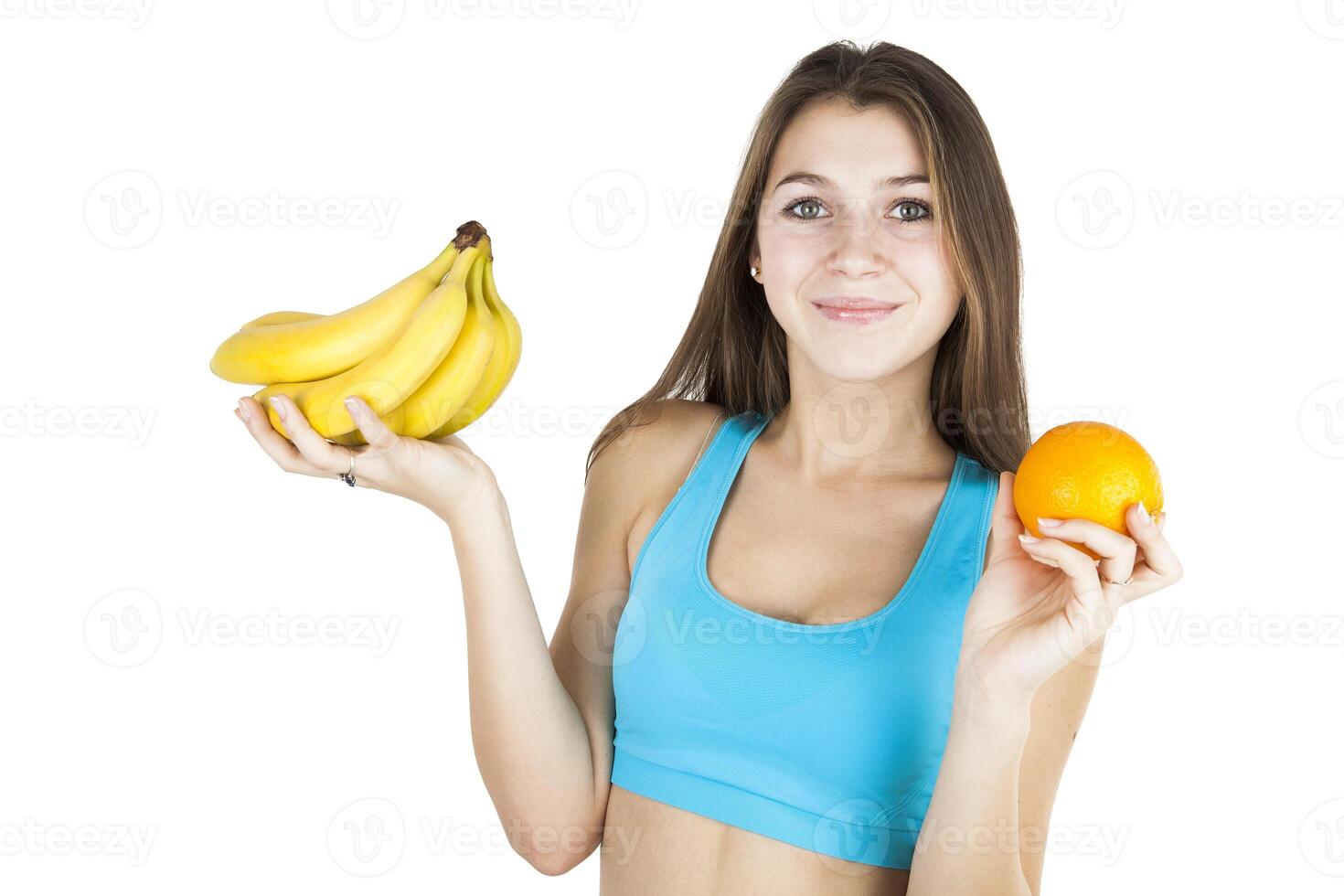 Athletic girl holding fruit photo