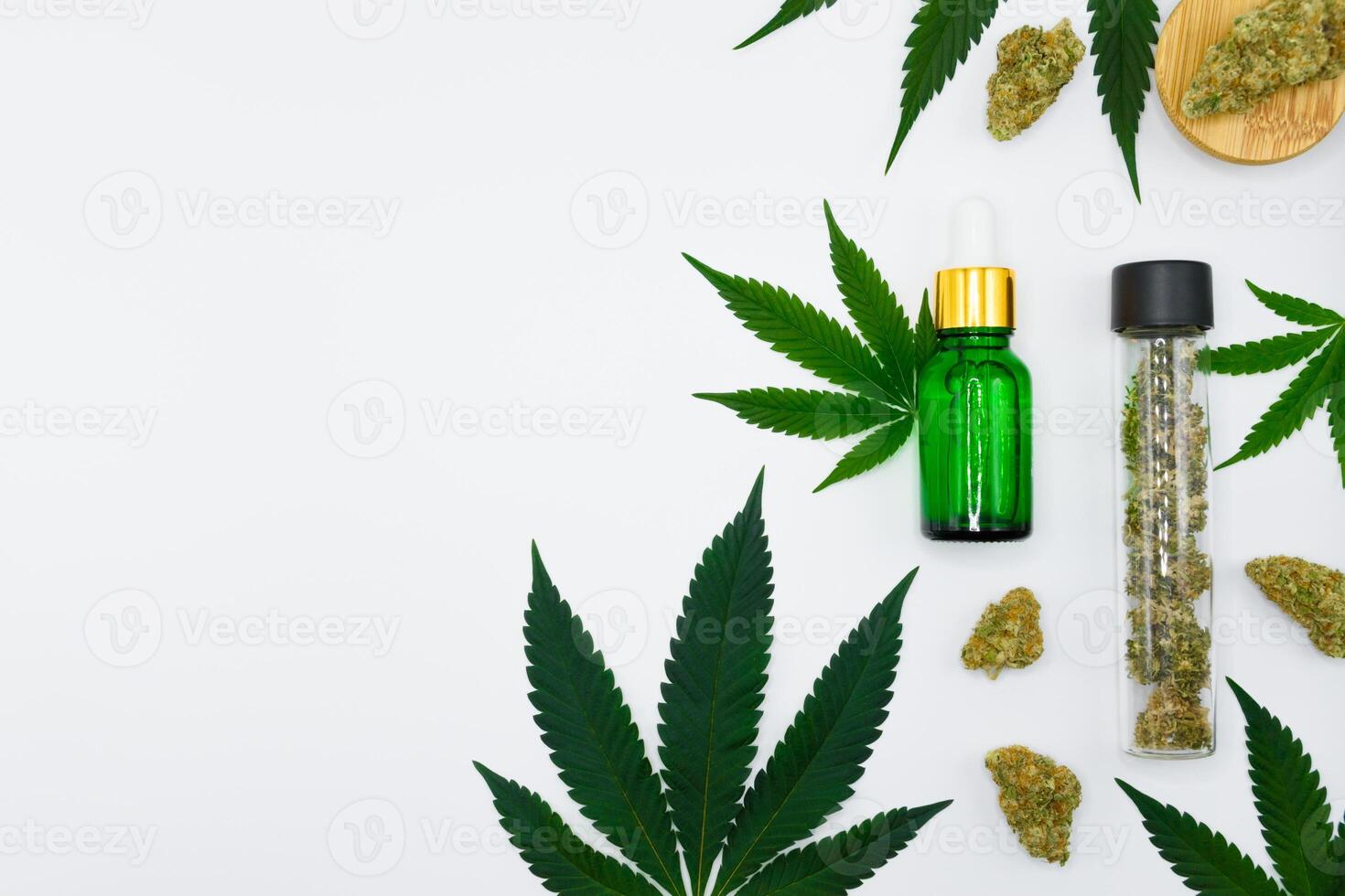 Top view of a cannabis buds with green leaf and green dropper bottle on white isolated background, Scientific experiment equipment in the laboratory, concept of marijuana oil extract, THC, CBD. photo