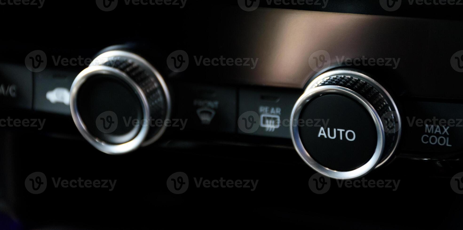 Button automatically adjust the air conditioning temperature in a modern car luxury interior 2024. Function control panel buttons in modern car. photo