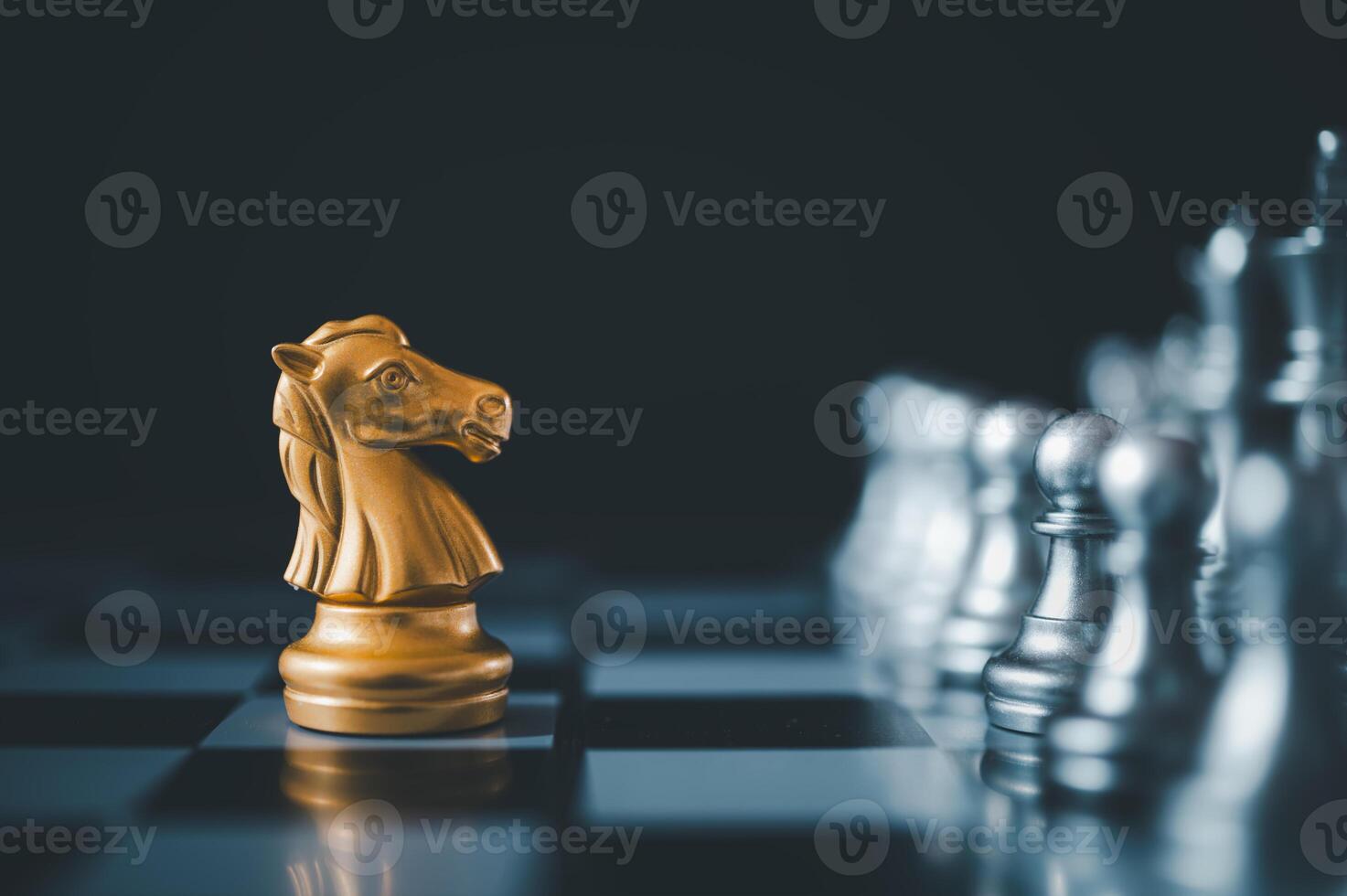 horse golden chess standing confront of the silver chess team.chess board game concept of business ideas and competition and stratagy plan success meaning photo