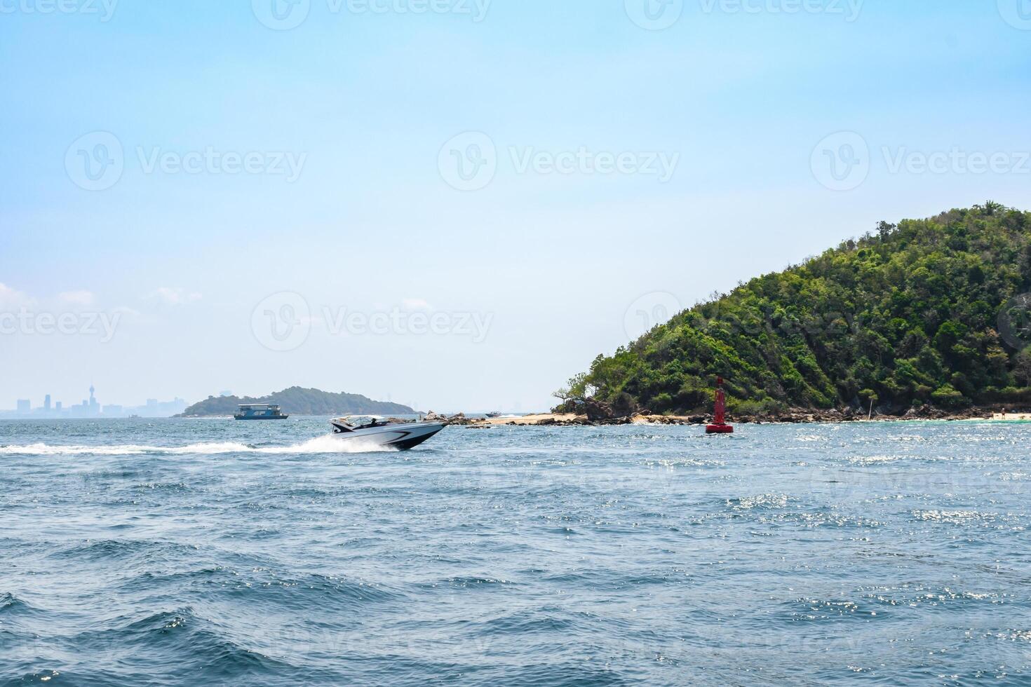 Landscape of island and tropical beach morning day at Koh Larn island on blue sea and blue clear sky background. Pattaya, Thailand. Wave, Speed boat, Ferry ship, Seascape, Vacation, Summer, Holiday. photo