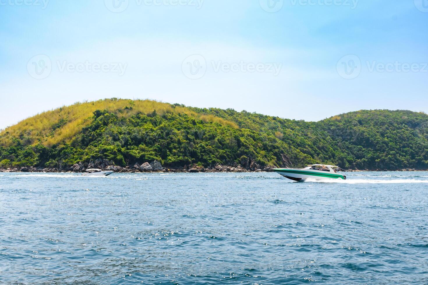 Landscape of island and tropical beach morning day at Koh Larn island on blue sea and blue clear sky background. Pattaya, Thailand. Wave, Speed boat, Ferry ship, Seascape, Vacation, Summer, Holiday. photo