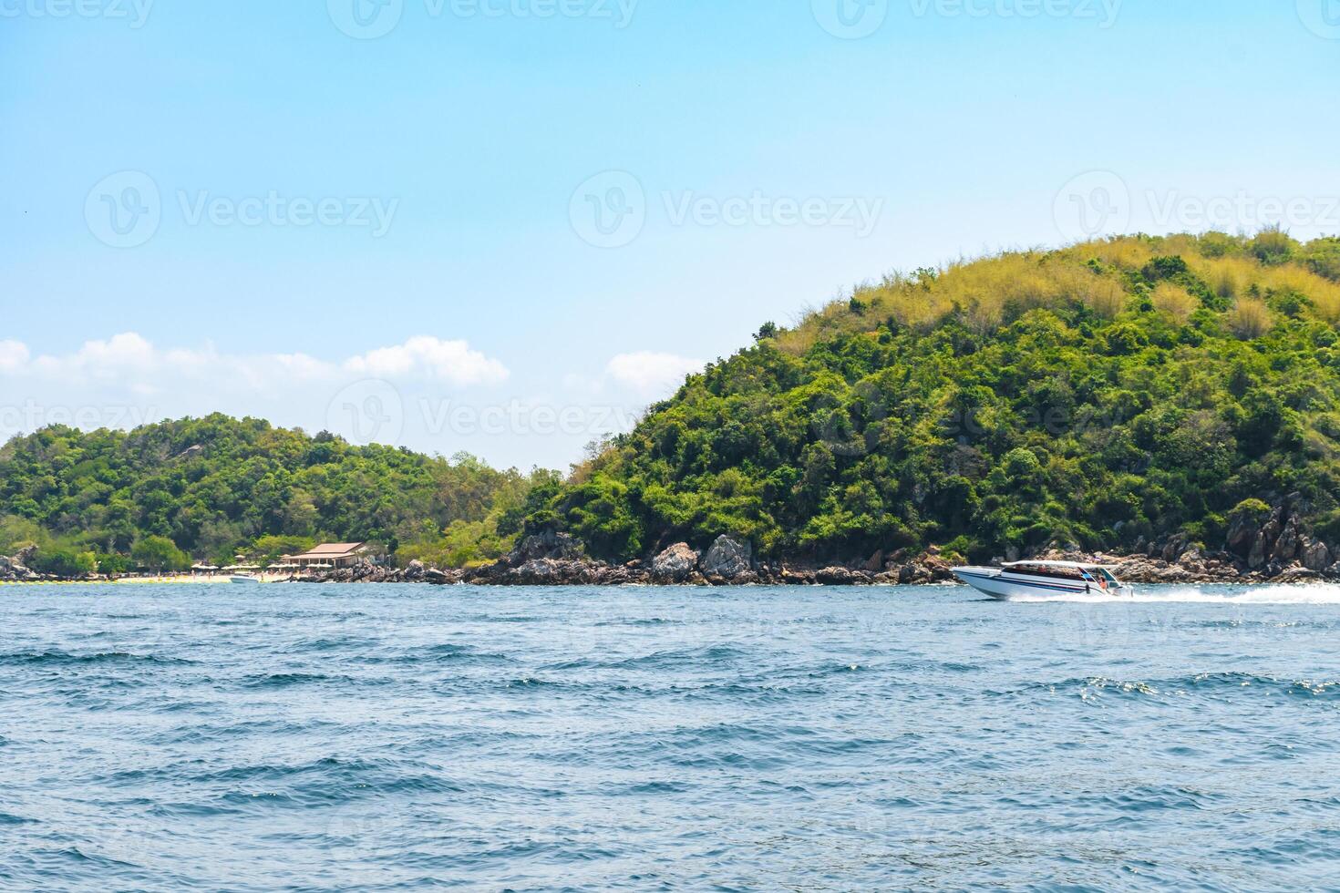Landscape of island and tropical beach morning day at Koh Larn island on blue sea and blue clear sky background. Pattaya, Thailand. Wave, Speed boat, Ferry ship, Seascape, Vacation, Summer, Holiday. photo
