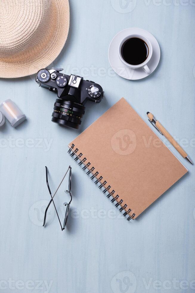 Top view of accessories of a person taking analog photography and a cup of coffee. photo