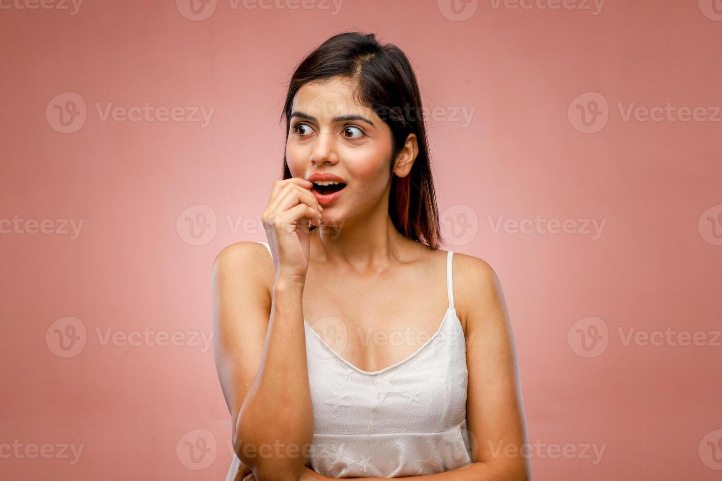 A Good Looking Mature Woman With Shocked Facial Expression photo