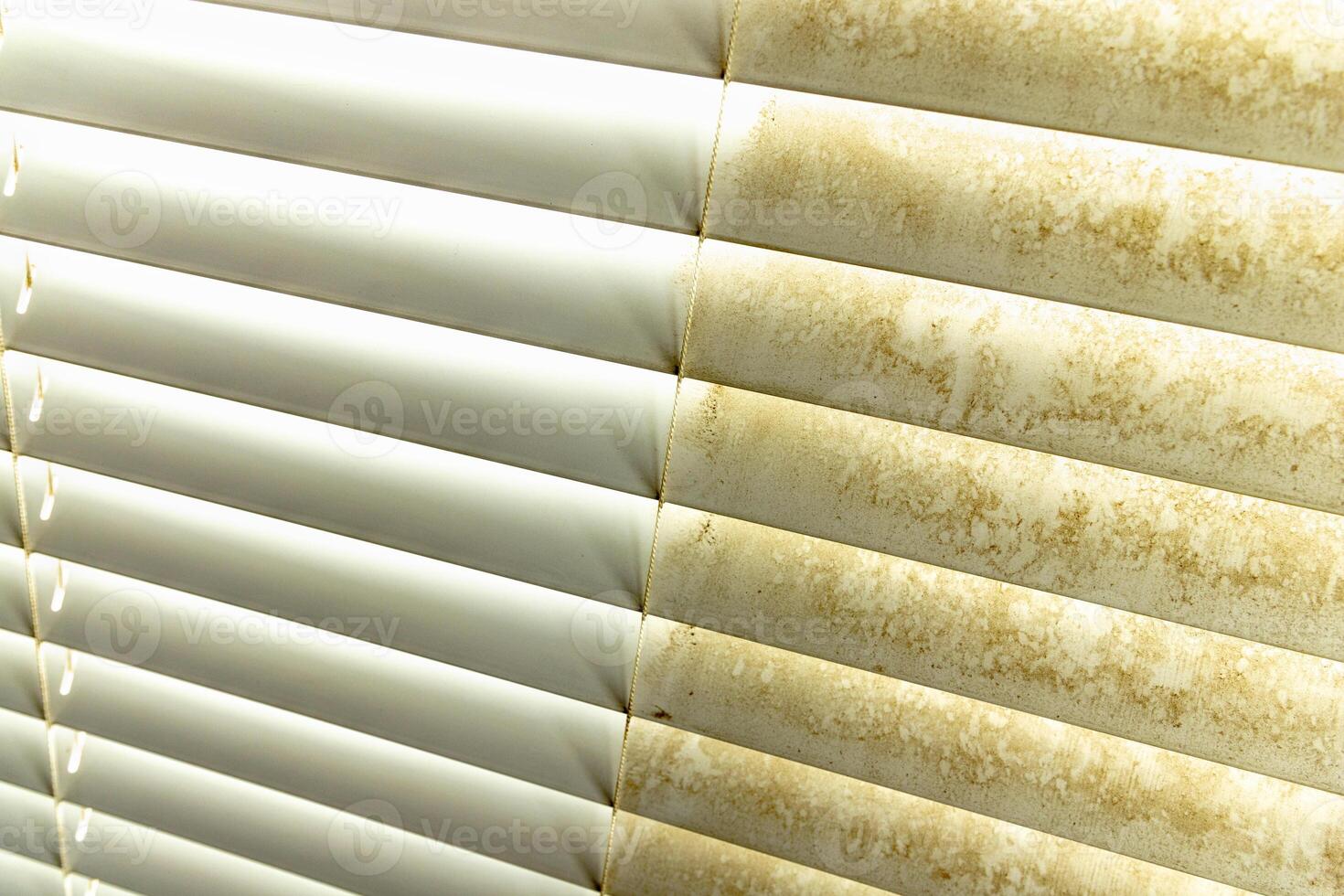 Residential Window Shades Showing the Before and After of a Good Cleaning - One Side Clean and One Side Dirty. photo