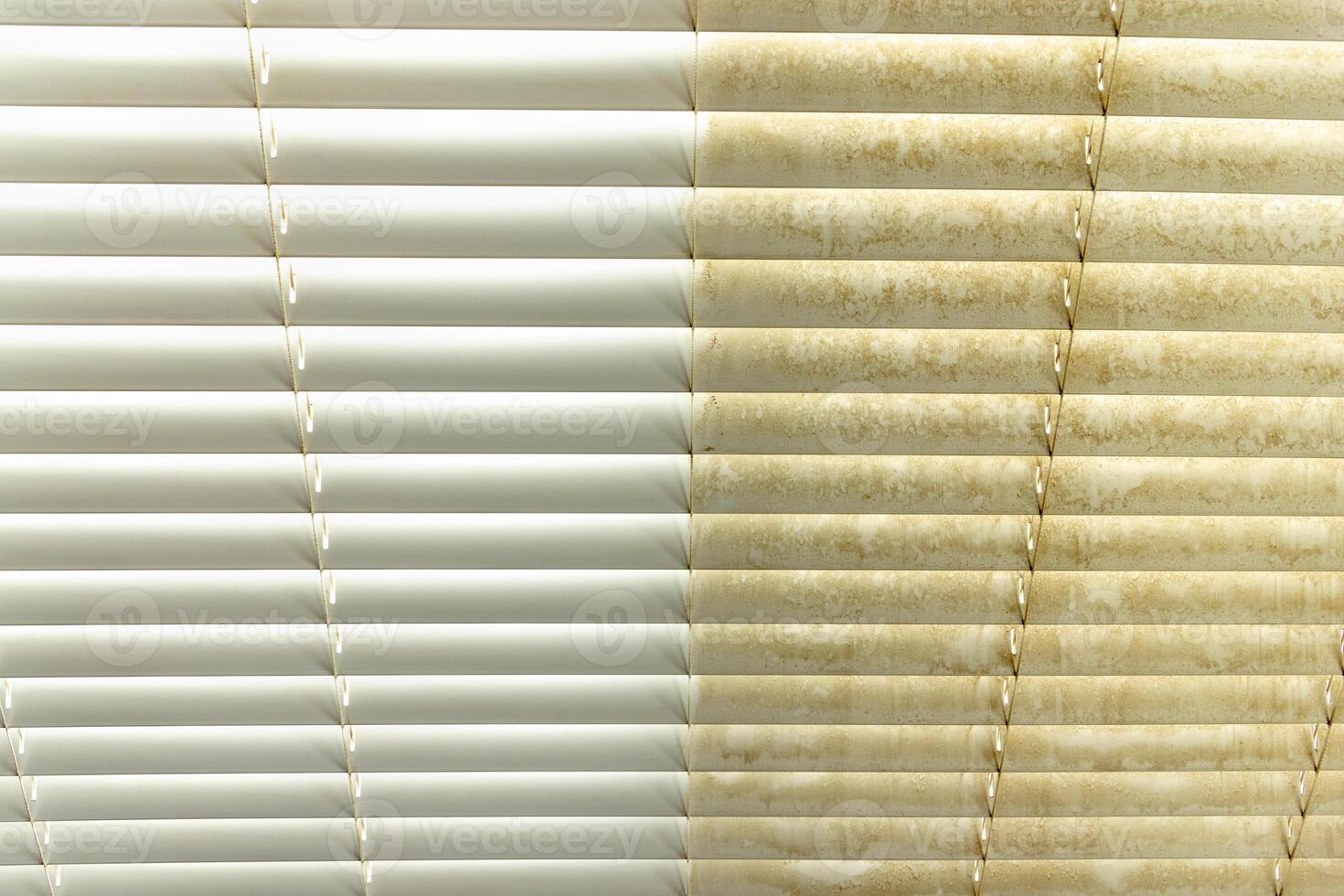 Residential Window Shades Showing the Before and After of a Good Cleaning - One Side Clean and One Side Dirty. photo