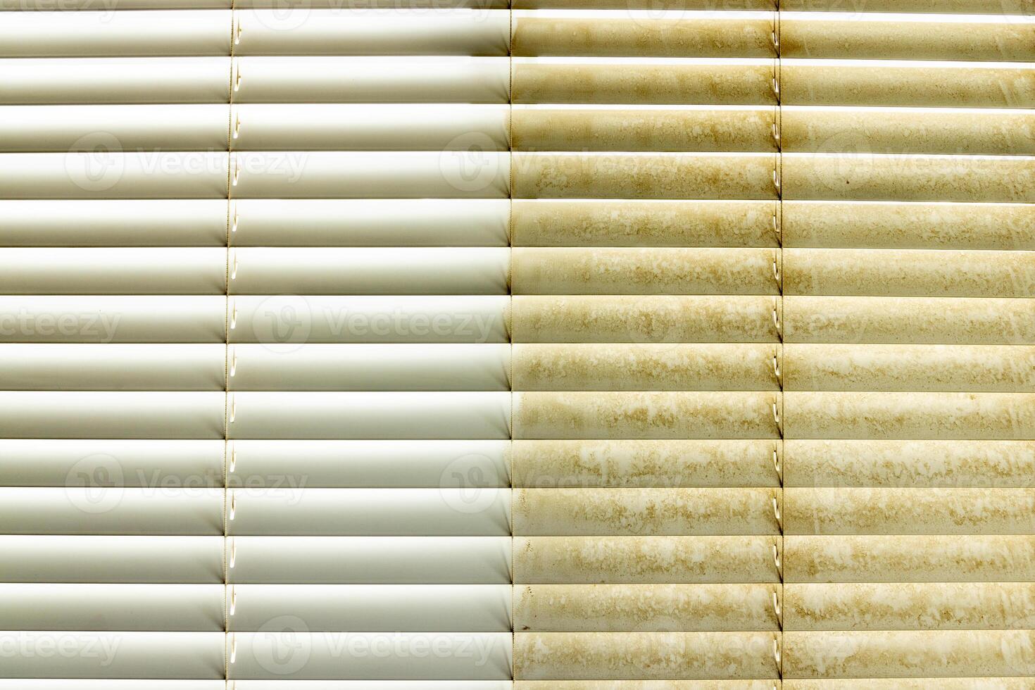Residential Window Shades Showing the Before and After of a Good Cleaning - One Side Clean and One Side Dirty. photo