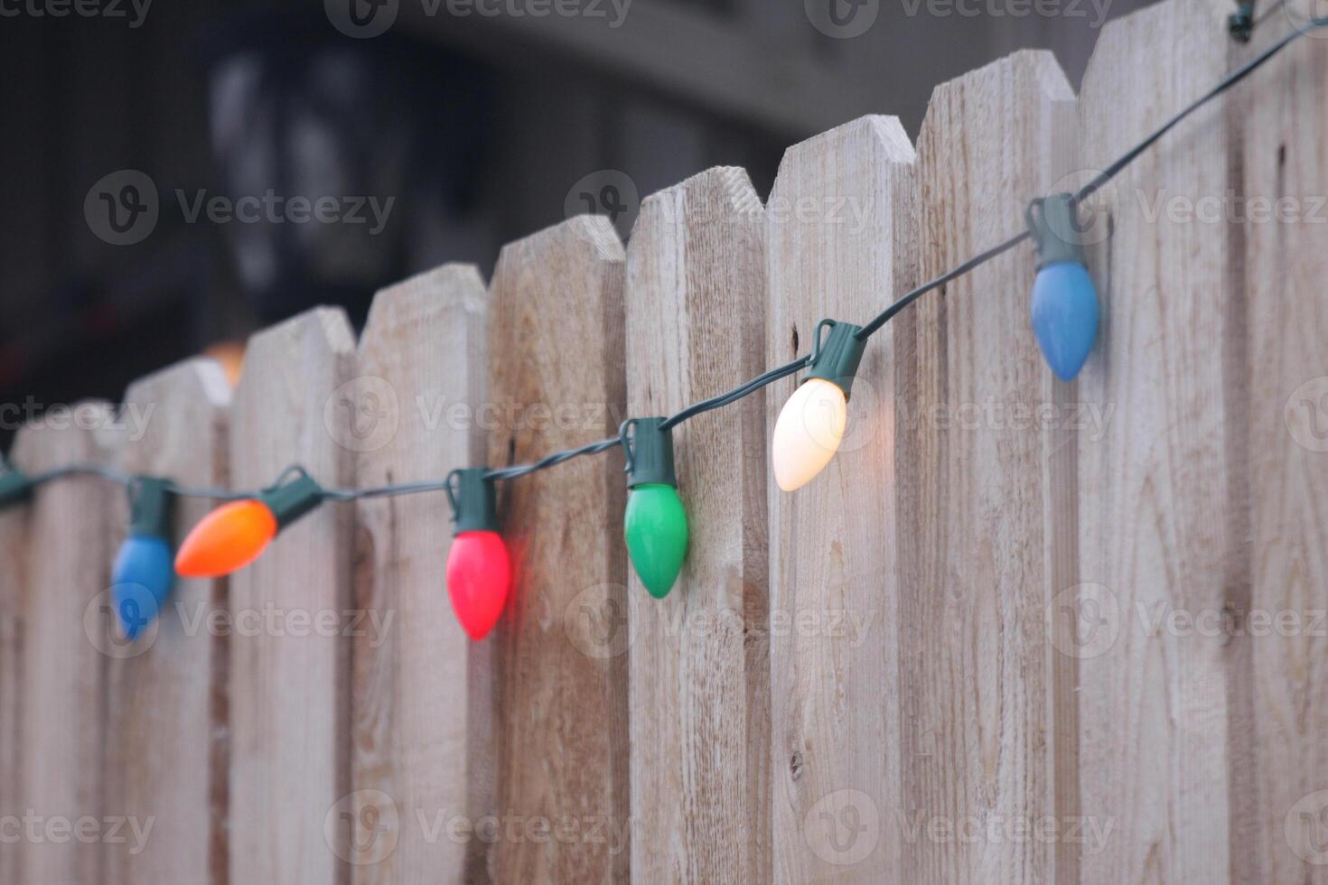 string lights on fence photo