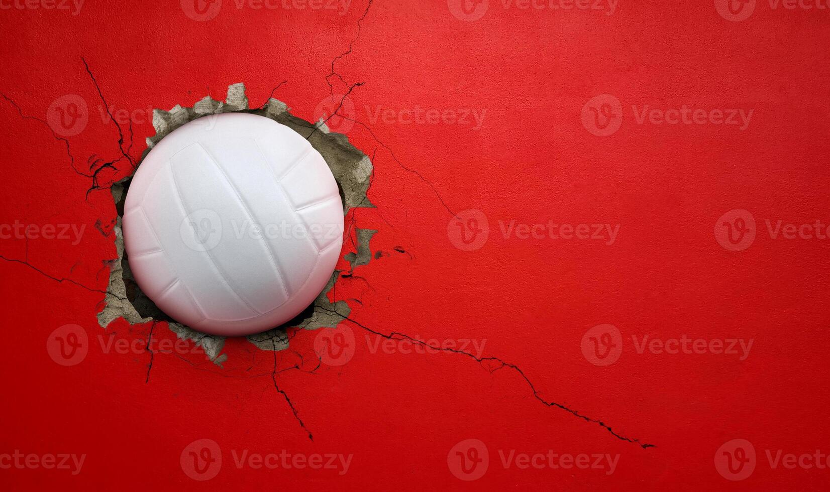 Volleyball breaks through red concrete wall concept of power, strength. photo