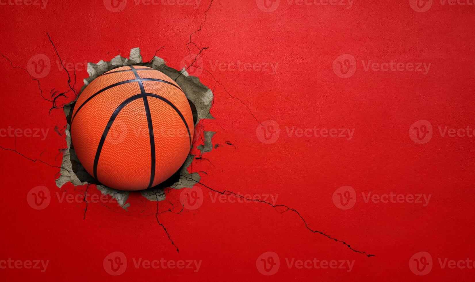 Basketball breaks through red concrete wall concept of power, strength. photo