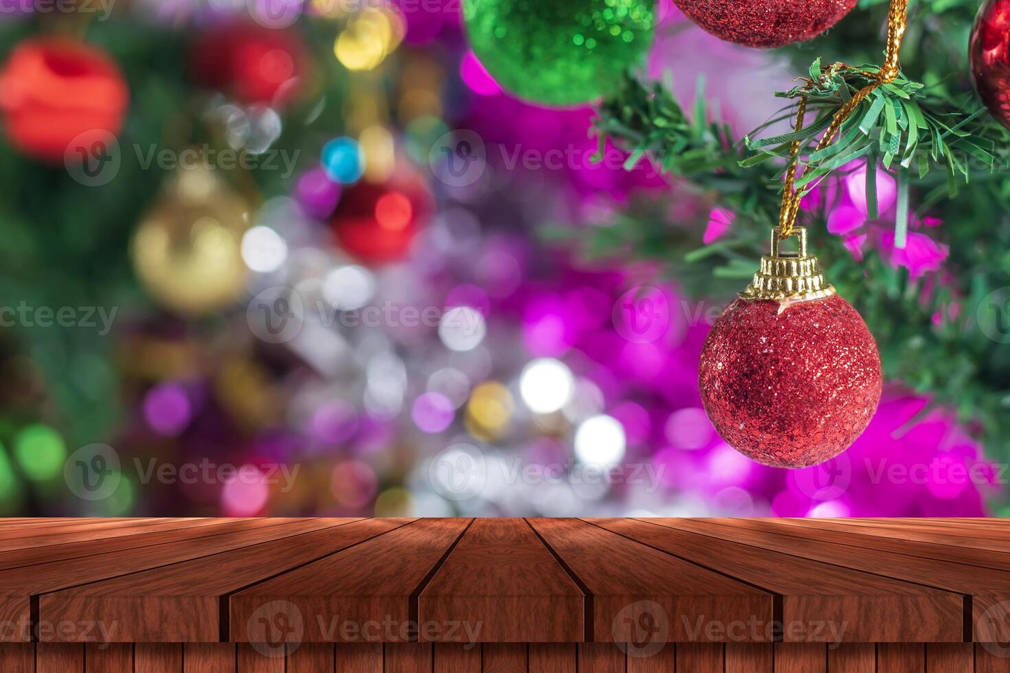 Christmas tree and wooden table with christmas decorations photo