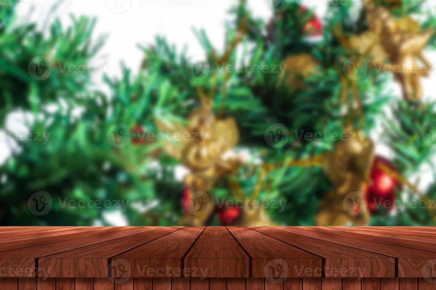 Christmas tree and wooden table with christmas decorations photo