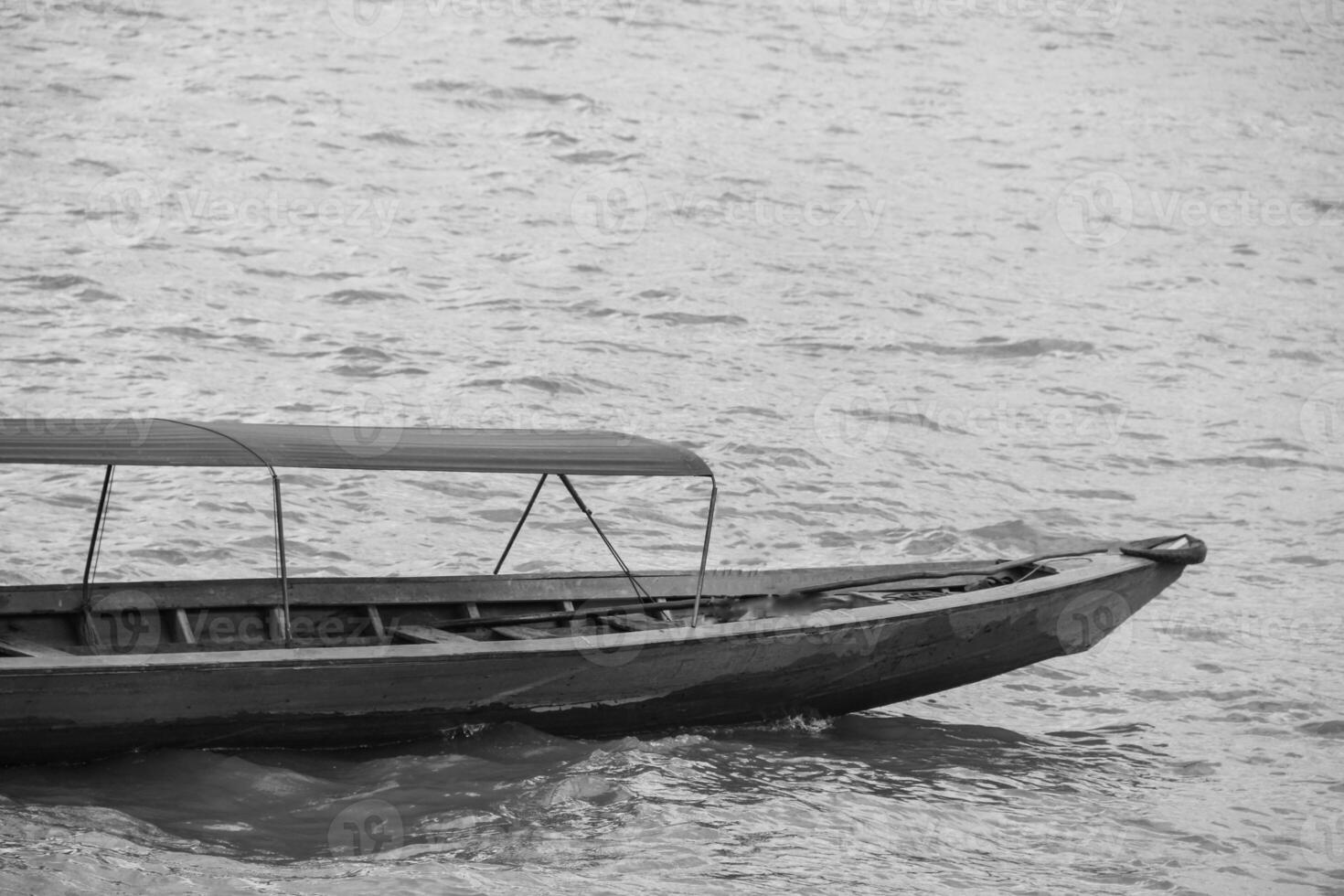 Boats or boats as a means of public transportation on the MUSI river. famous river in the city of Palembang, South Sumatra, Indonesia. photo