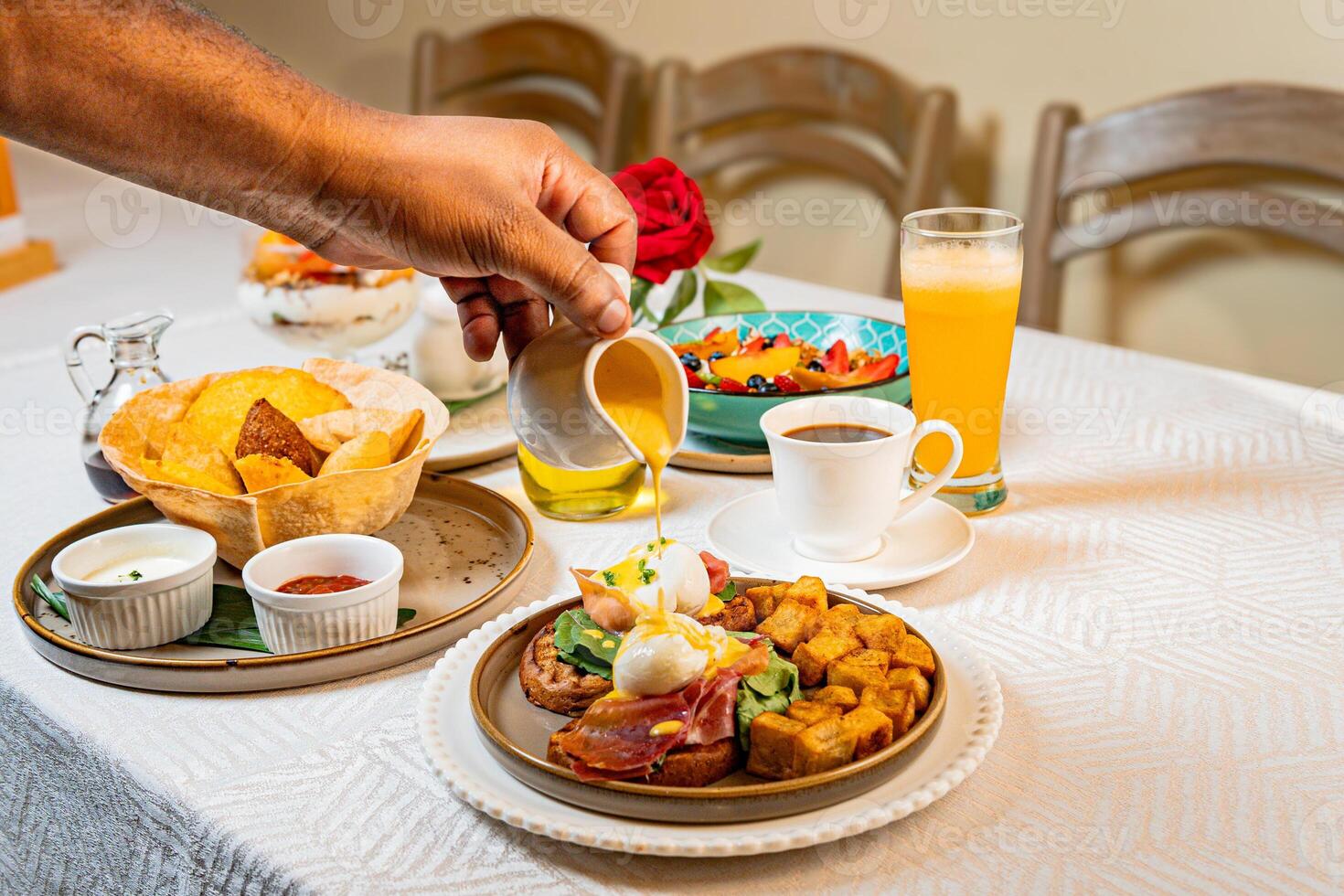 Gourmet breakfast with pieces of pork cracklings, toast, burrata, and serrano ham photo