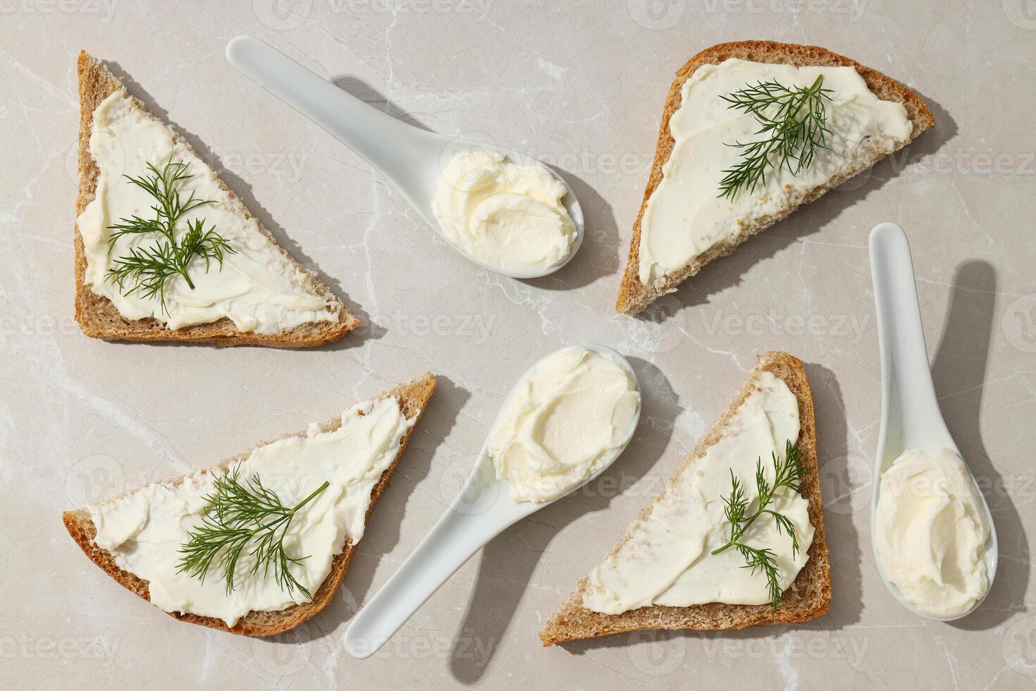 Sandwiches with Philadelphia cheese on a light background. photo