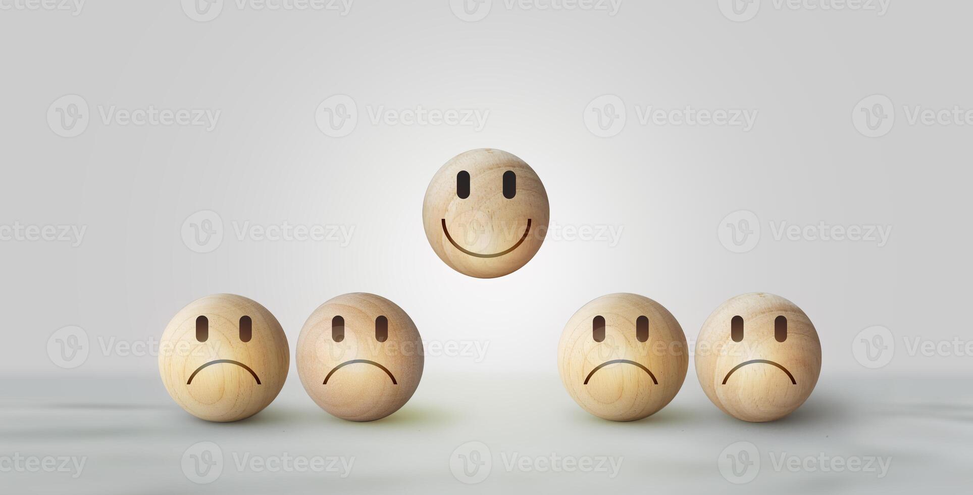 Smile icon wooden ball, sad face in dark side on wooden block cube for positive mindset selection. Concept of recruiting photo